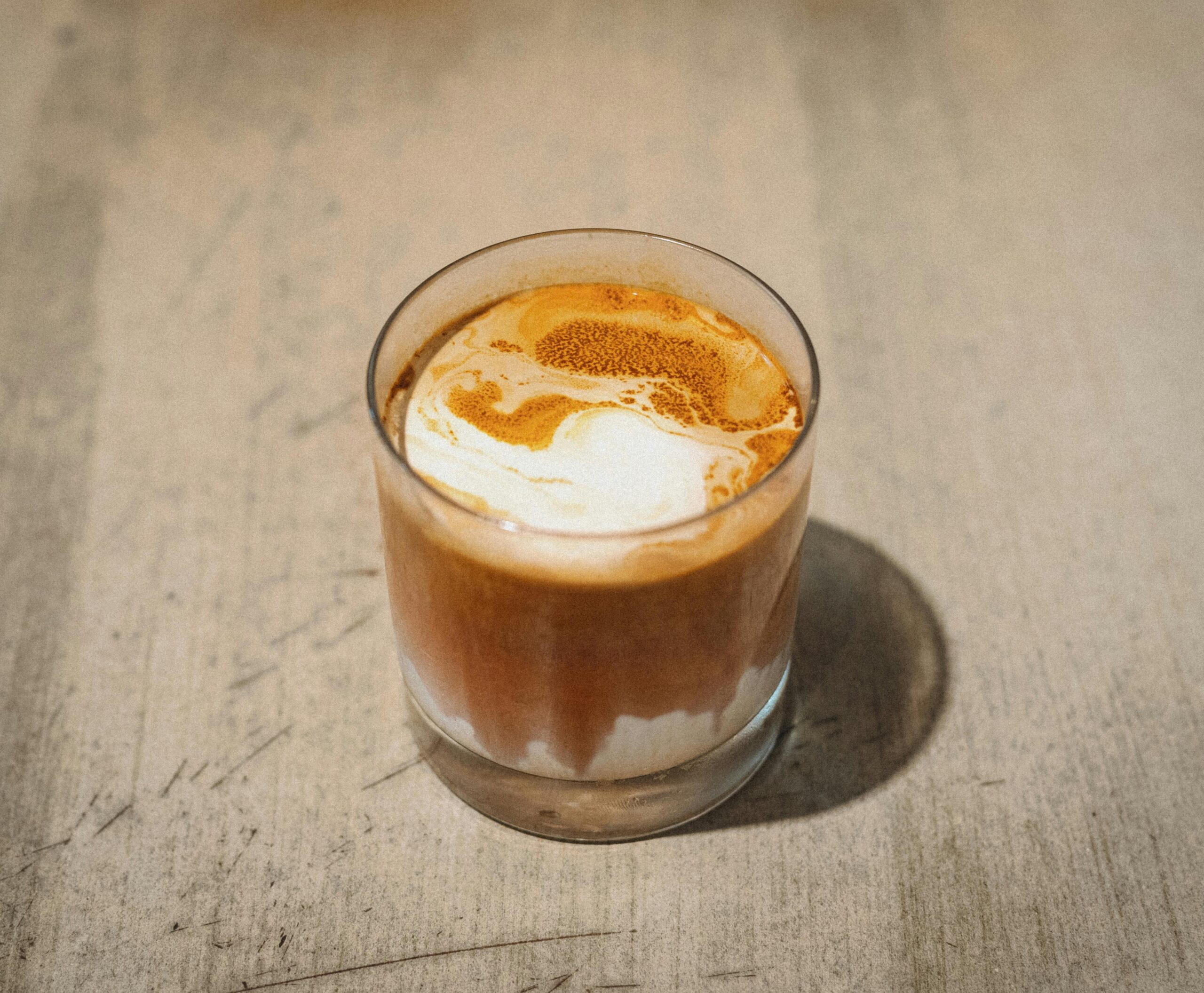 Aromatic glass of espresso with a beautiful creamy swirl, captured in Shinjuku, Tokyo.